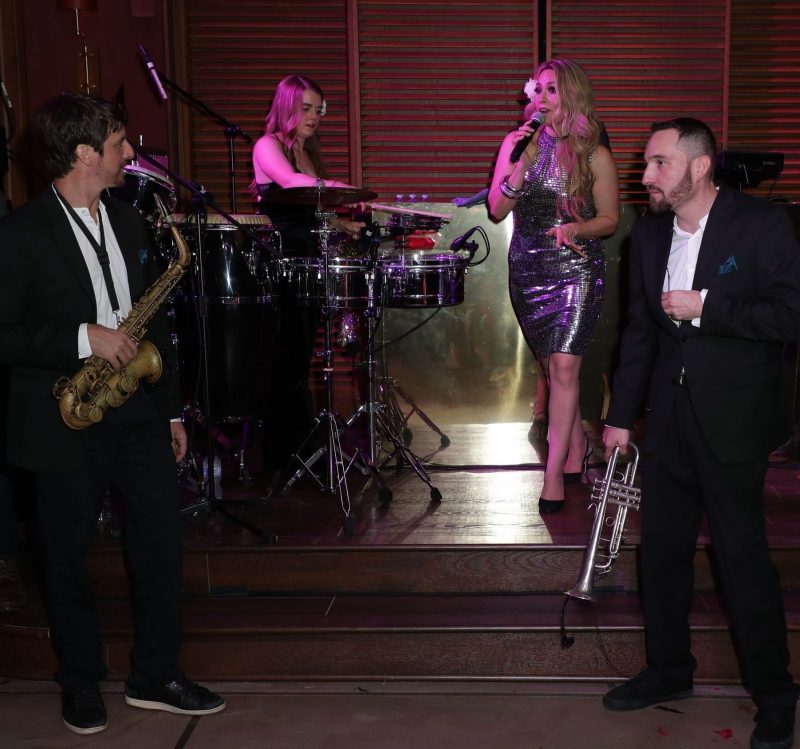 The Horns Performing at Opening Party