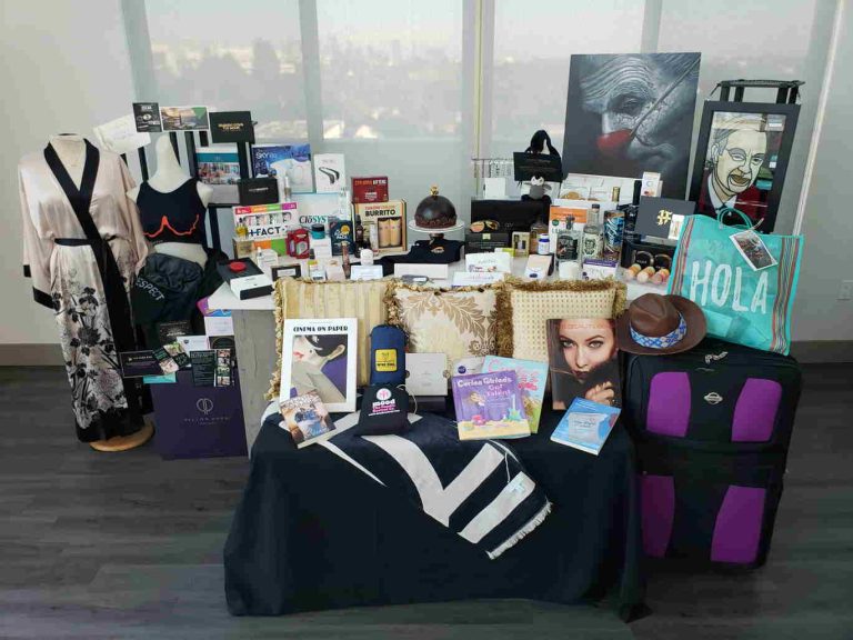 Peek Inside The Six Figure Gift Bag That Oscar Nominees Brad Pitt, Charlize Theron + Margot Robbie Are Receivi...