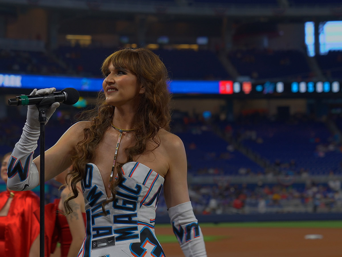 Haute Living Miami Ambassador Radmila Lolly Performs At The Miami Marlins' Season Opener Game