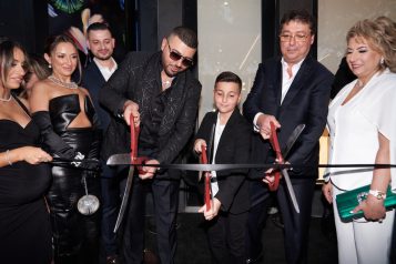 Avi Hiaeve and his family cut the ribbon to their new storefront.