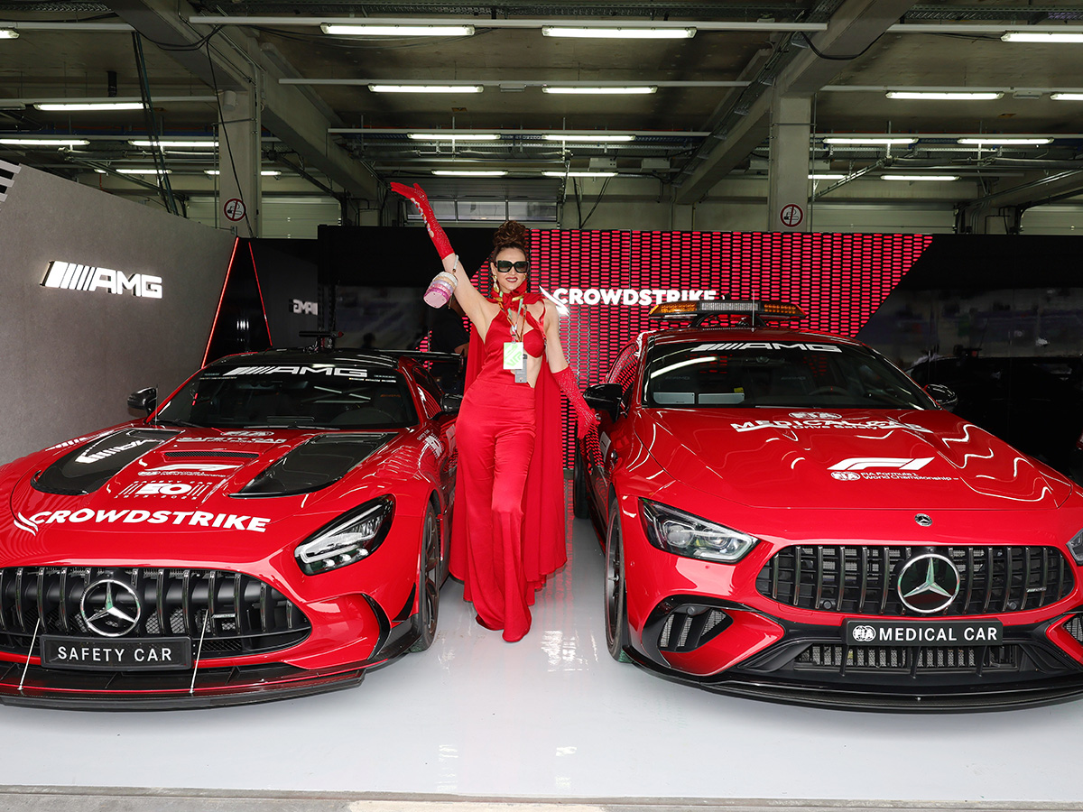 Haute Living Ambassador Radmila Lolly Wears A Bespoke Gown Made Of F1 Driver Jerseys To The Austrian Grand Prix