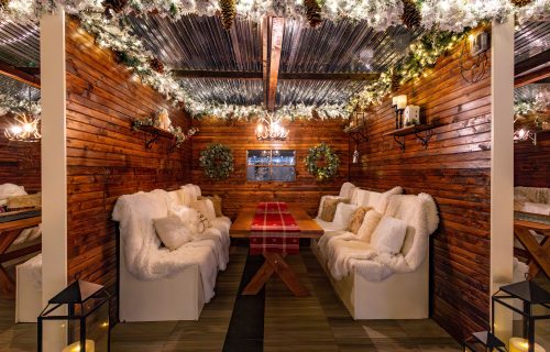 Winter in Los Angeles doesn’t typically come with snow-capped peaks or alpine lodges — but for a few magical months each year, Fairmont Century Plaza manages to conjure the feeling anyway. Returning for the season, Après LA: A Fairmont Century Plaza Chalet Experience transforms the hotel’s outdoor terrace into one of the city’s most transportive winter escapes, where candlelight flickers, fire pits glow, and chalet-style dining brings a touch of European après-ski romance to the heart of Century City. Opening November 22, the experience unfolds across five private chalets, each designed to feel intimate, cozy, and indulgent — the kind of place where evenings stretch longer than planned and conversations linger over one more cocktail. Snow-dusted greenery frames the space, while plush seating and warm textures soften the crisp evening air, creating an atmosphere that feels worlds away from the usual Los Angeles rhythm. Each chalet accommodates two to eight guests for a 90-minute dining experience, with seating available from 3:30 p.m. to 9:30 p.m. Check-in begins at The Bar, making it easy to ease into the evening with a cocktail before slipping into your own private winter hideaway. Reservations are complimentary, with a $25 per-person cancellation fee applied within 24 hours — a small commitment for one of the most coveted seasonal reservations in the city. The menu is unapologetically comforting and perfectly calibrated for cold-weather indulgence. Guests can gather around signature cheese fondue, share a curated charcuterie board from Lumière, and explore a festive cocktail lineup created in partnership with The Macallan, the chalet’s distinguished beverage collaborator. New this season, Macallan tasting flights take center stage, inviting guests to explore rare and premium expressions alongside chalet classics like The Red Thread (built on Macallan 12 Double Cask), the Spiced Pear Hot Toddy, and the fan-favorite Espress-ski Martini — the kind of drink that feels especially right when wrapped in a blanket under the stars. For those who don’t want the night to end, Fairmont Century Plaza makes lingering effortless. The Après LA room offer provides 20% off accommodations, allowing guests to quite literally “take the elevator home” after dinner — no rideshares, no rush, just a seamless transition from festive evening to restful night. Adding an extra layer of luxury, the hotel introduces its Canada Goose Lending Program exclusively for Fairmont Gold guests this winter. A curated selection of outerwear is available to borrow during the stay, offering both warmth and style for chalet evenings outdoors — and a rare opportunity to test-drive the brand’s newest silhouettes in real-world conditions. Fairmont Chalet Excursion