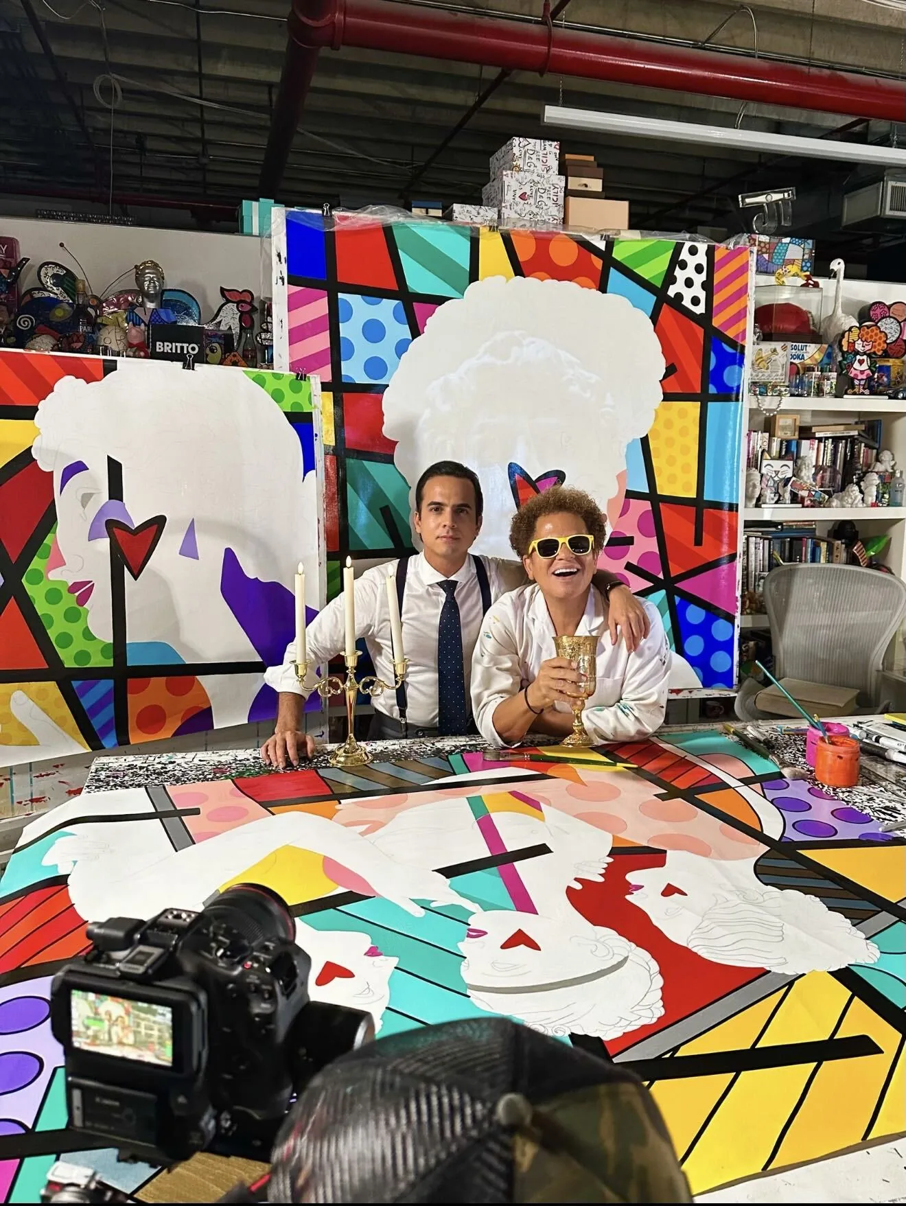 Romero Britto with Dr. Lucas Vidal, CEO of Romero Britto and Britto Group, in the artist