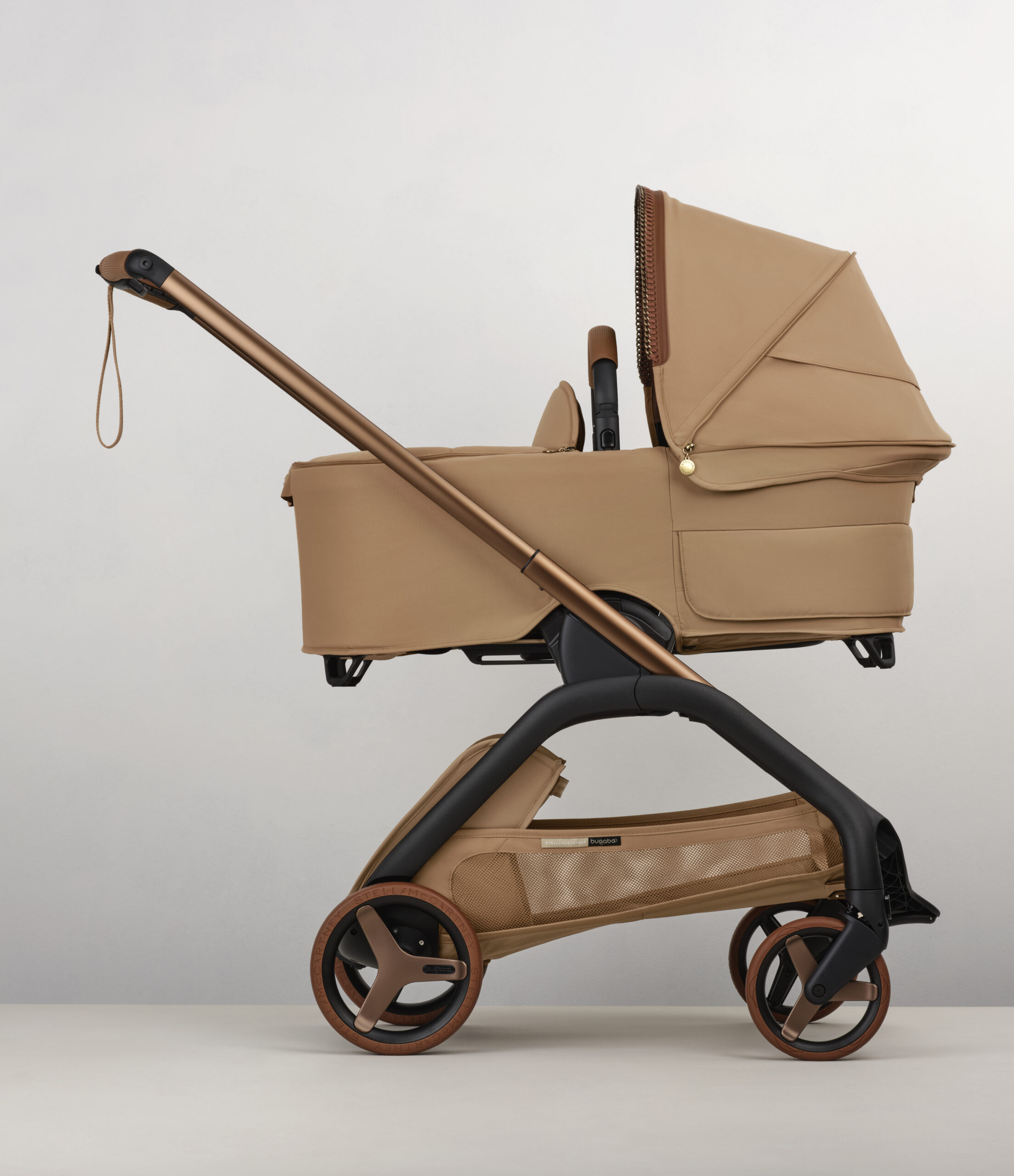 100292006 stellamccartney dragonfly plus bassinet complete tobacco brown iconic Grey BG - Bugaboo x Stella McCartney: The Luxury Stroller Collaboration Every Stylish Parent Needs