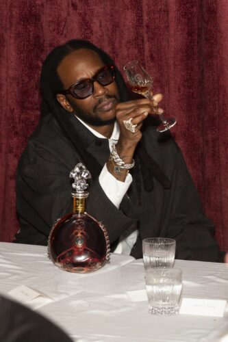 2 Chainz holding a glass of Louis XIII cognac at Verde New York