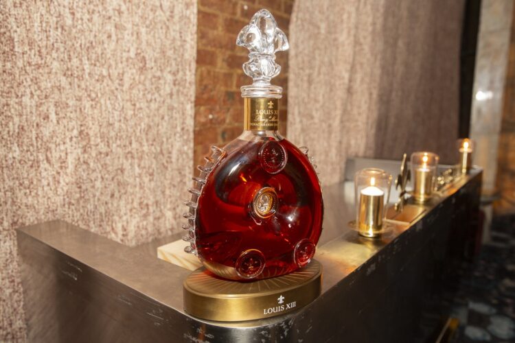 Louis XIII decanter beside candles at Verde New York