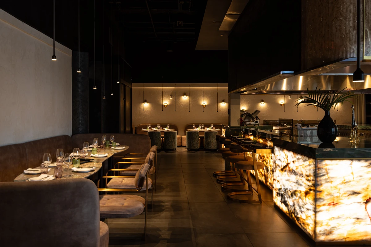 Banquette seating and the backlit chef