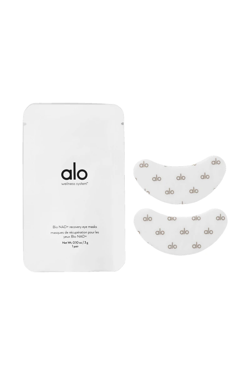 An ALO Bio NAD+ Recovery Eye Masks pouch with two eye patches on a white background, a pick inspired by the ALO Plaza Athénée takeover