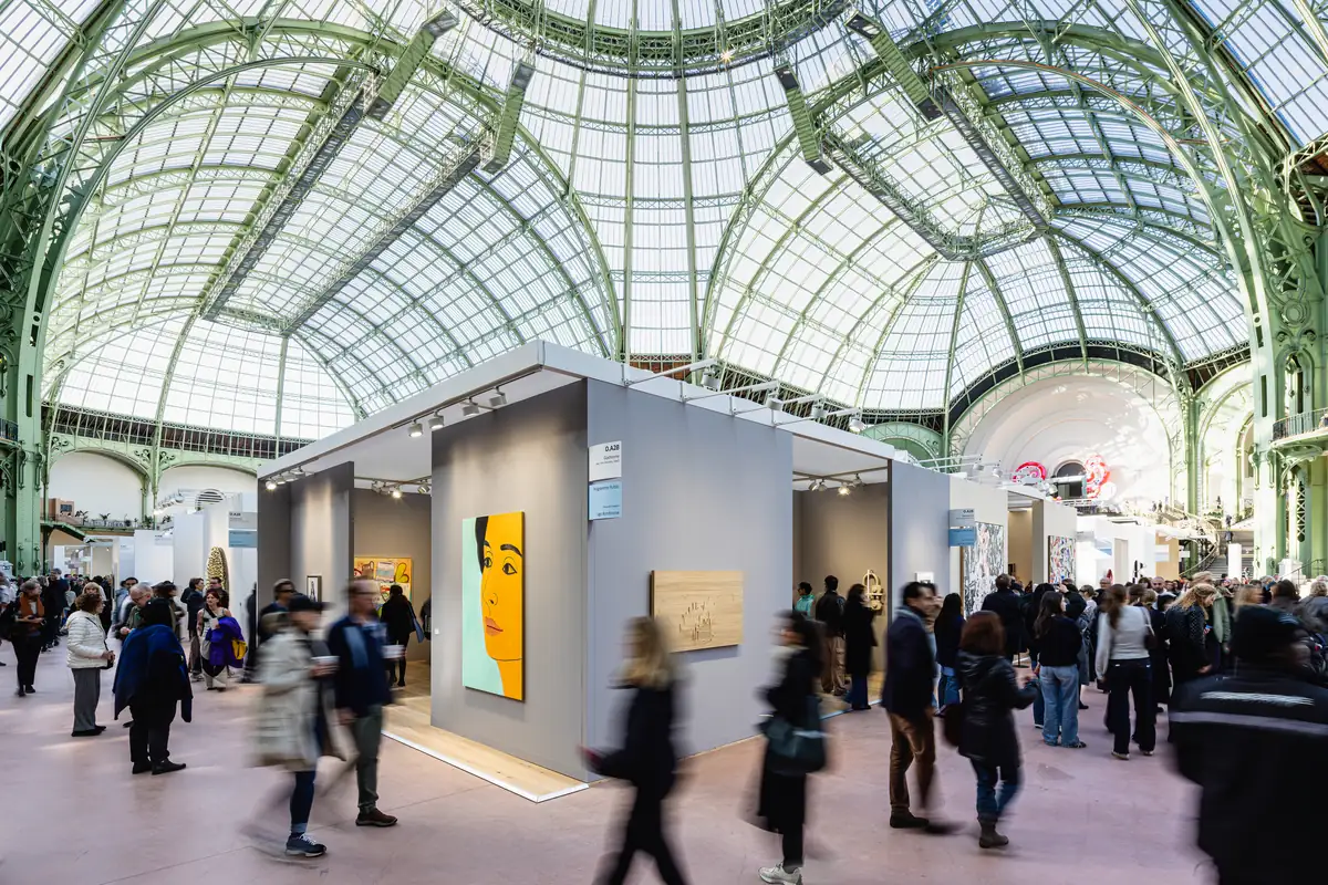 Luxury brands at Art Basel Paris draw visitors to the gallery booths in the glass-roofed nave of the Grand Palais