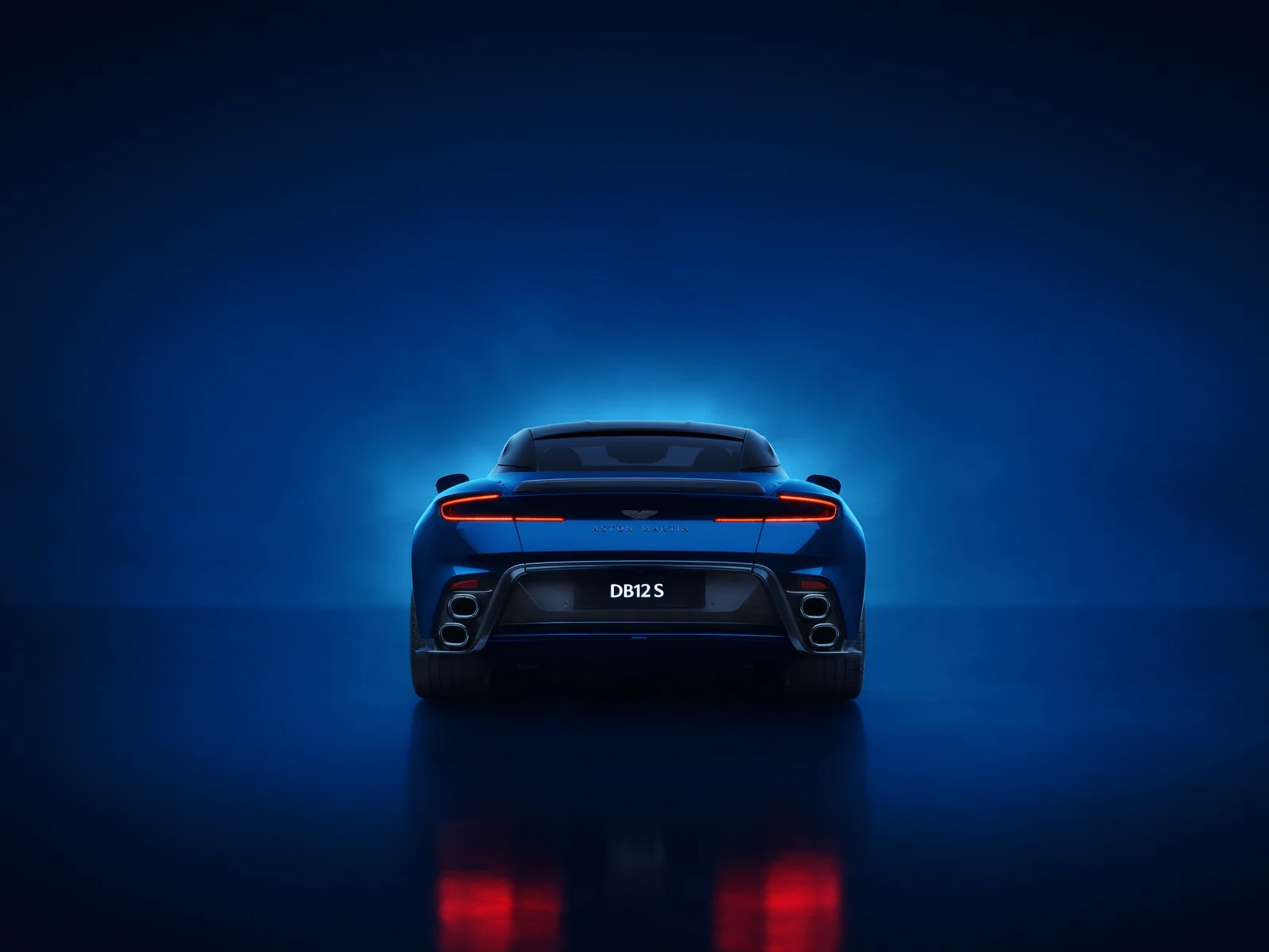 2026 Aston Martin DB12 S Coupe rear with quad stacked exhaust tailpipes