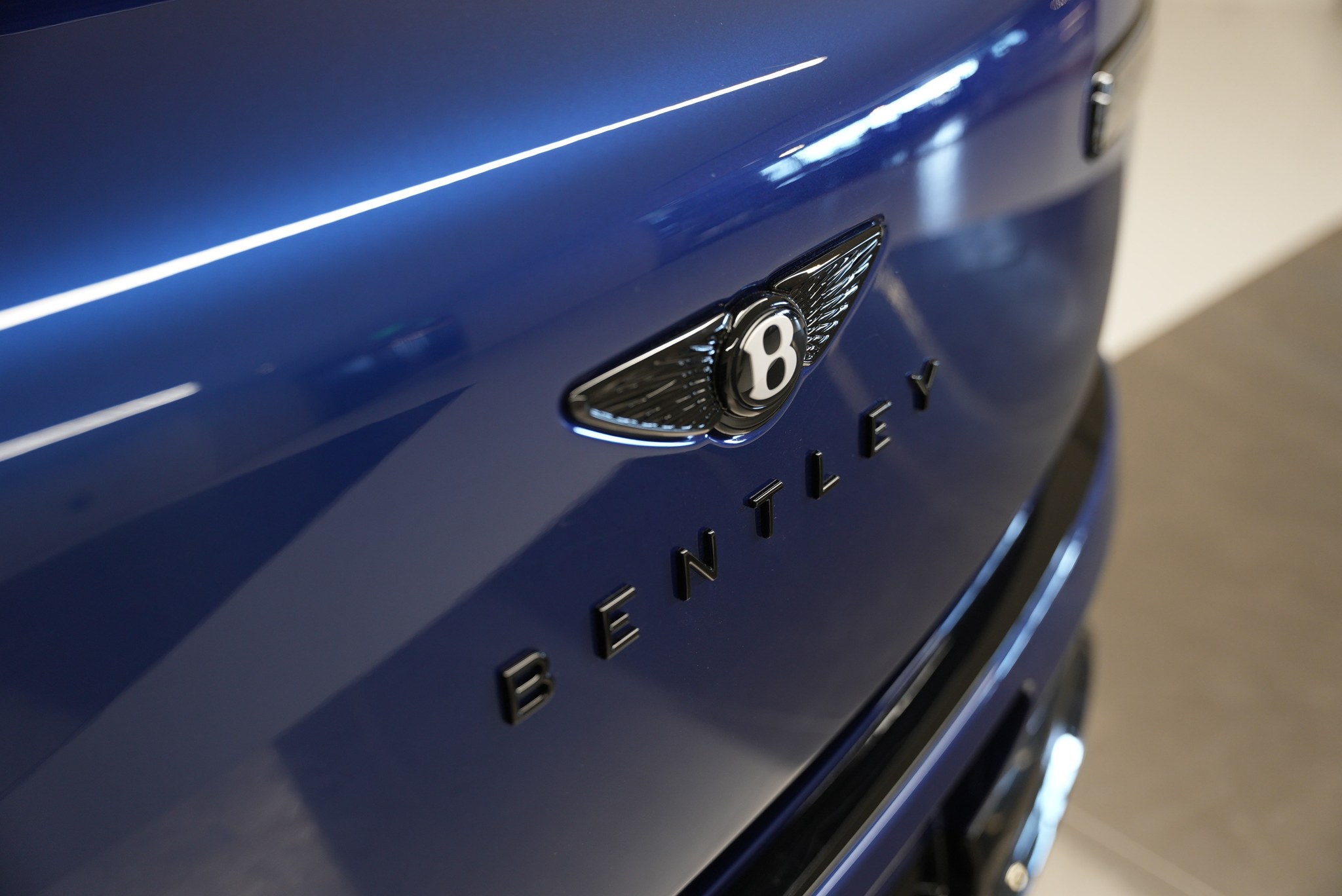 Close-up of the Bentley badge on the 2027 Bentley Torcal at its Florida debut