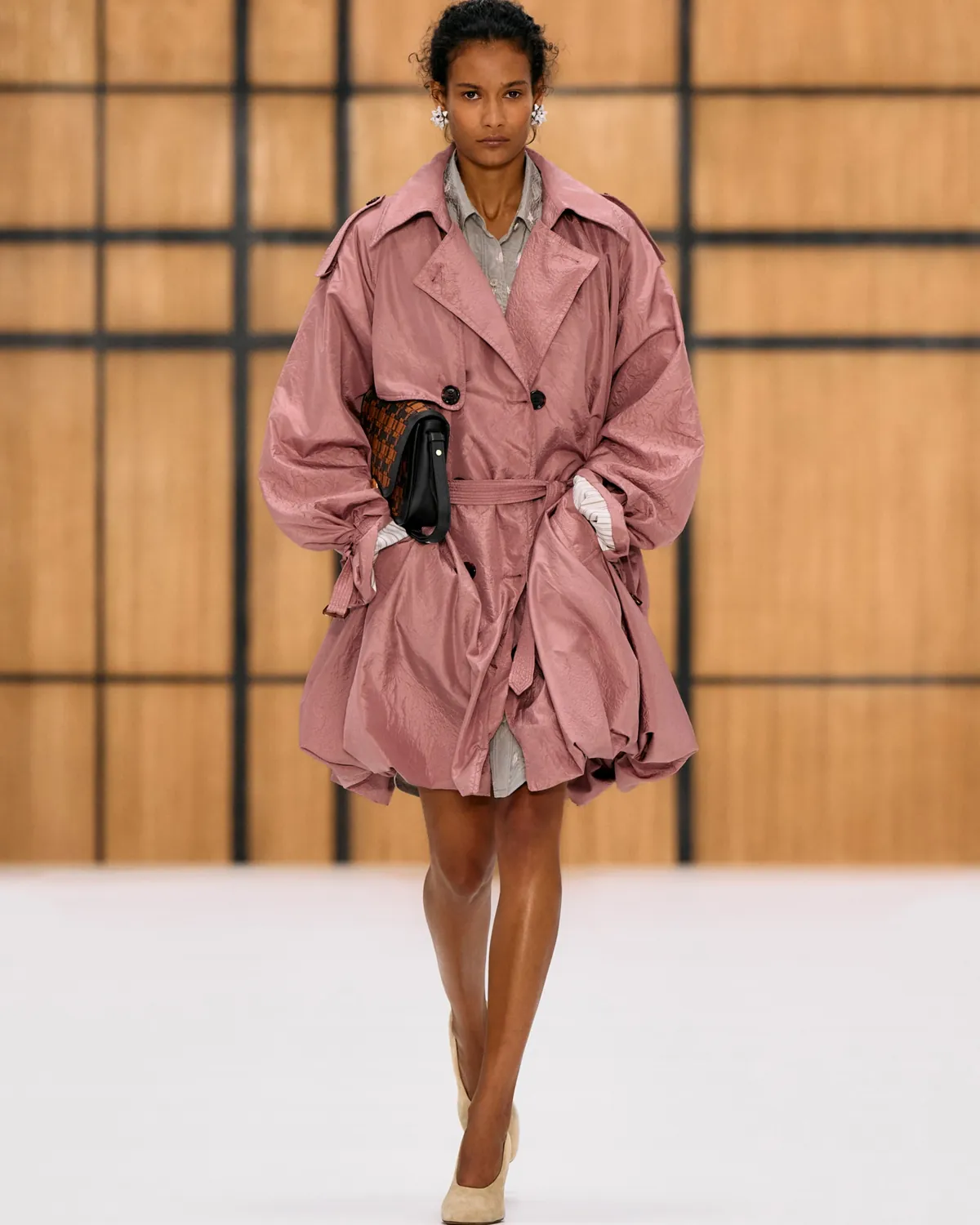 Burberry Summer 2027, a pink silk trench with a gathered puffball hem, at London Fashion Week