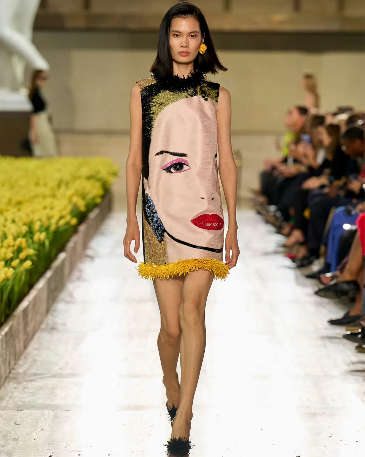 Carolina Herrera Spring 2027 Look 16, an embroidered Andy Warhol portrait mini dress, at New York Fashion Week