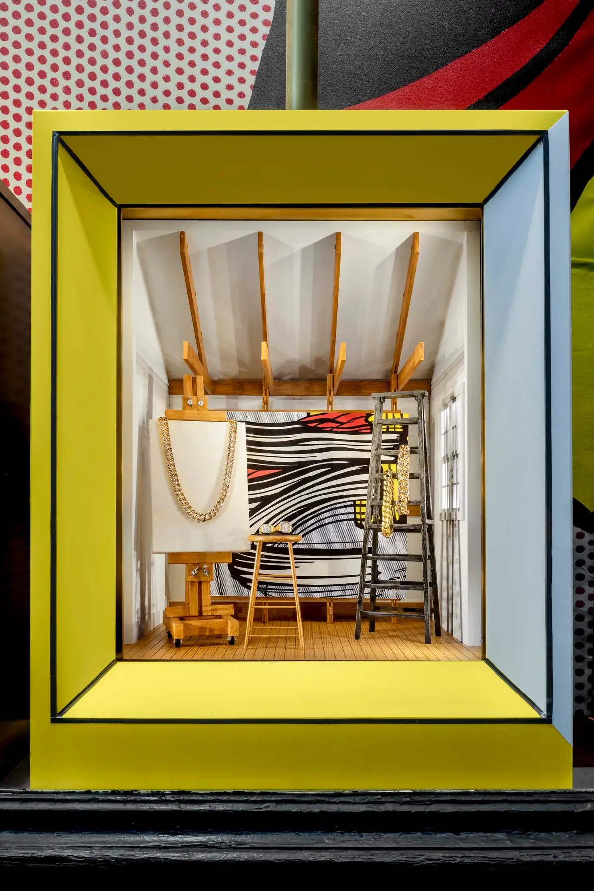 David Yurman Roy Lichtenstein Soho window vignette with a brushstroke-style canvas and a David Yurman chain necklace on an easel