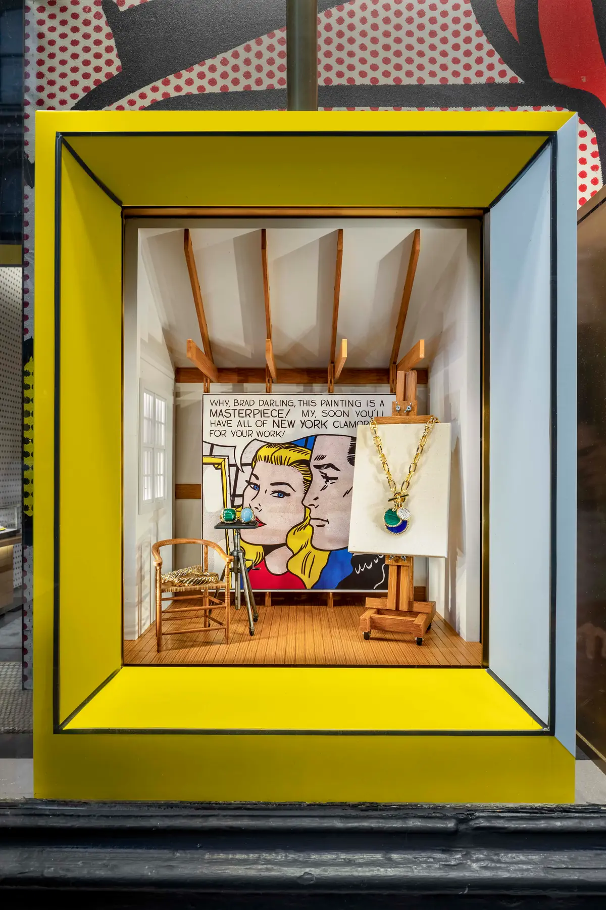 David Yurman Roy Lichtenstein Soho window vignette pairing a comic-panel canvas on an easel with a David Yurman necklace in a miniature artist studio