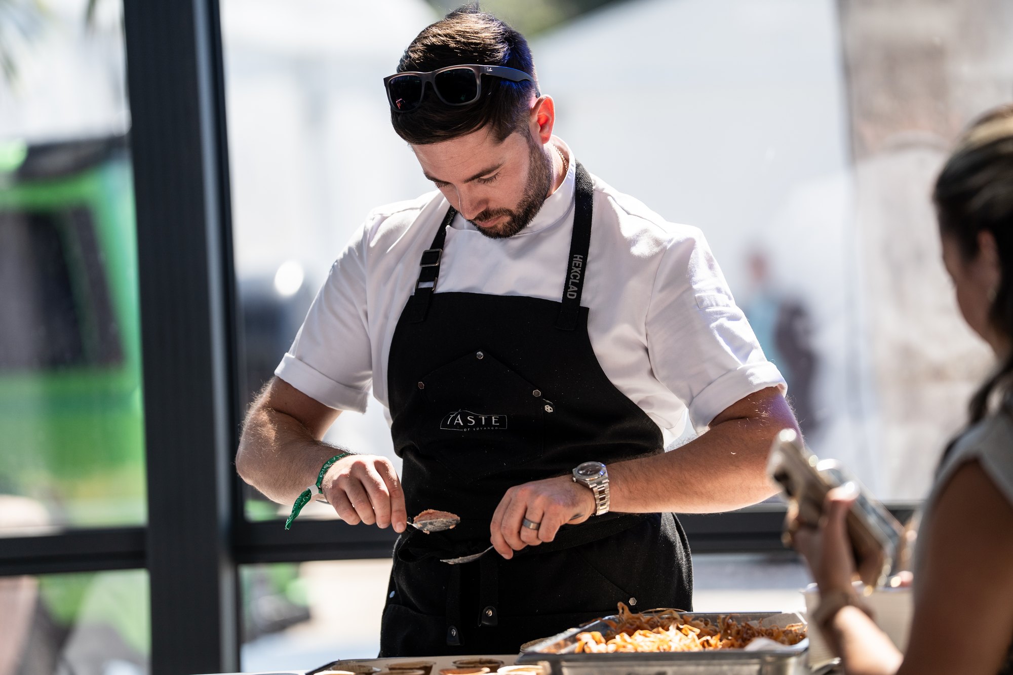 A chef plating dishes for guests at Superyacht Village during the Fort Lauderdale International Boat Show