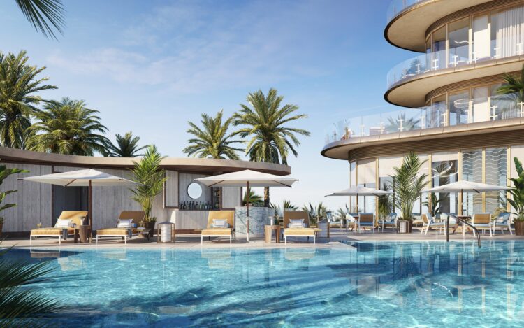 Four Seasons Private Residences Coconut Grove pool deck with loungers, umbrellas and palm trees at the base of the tower