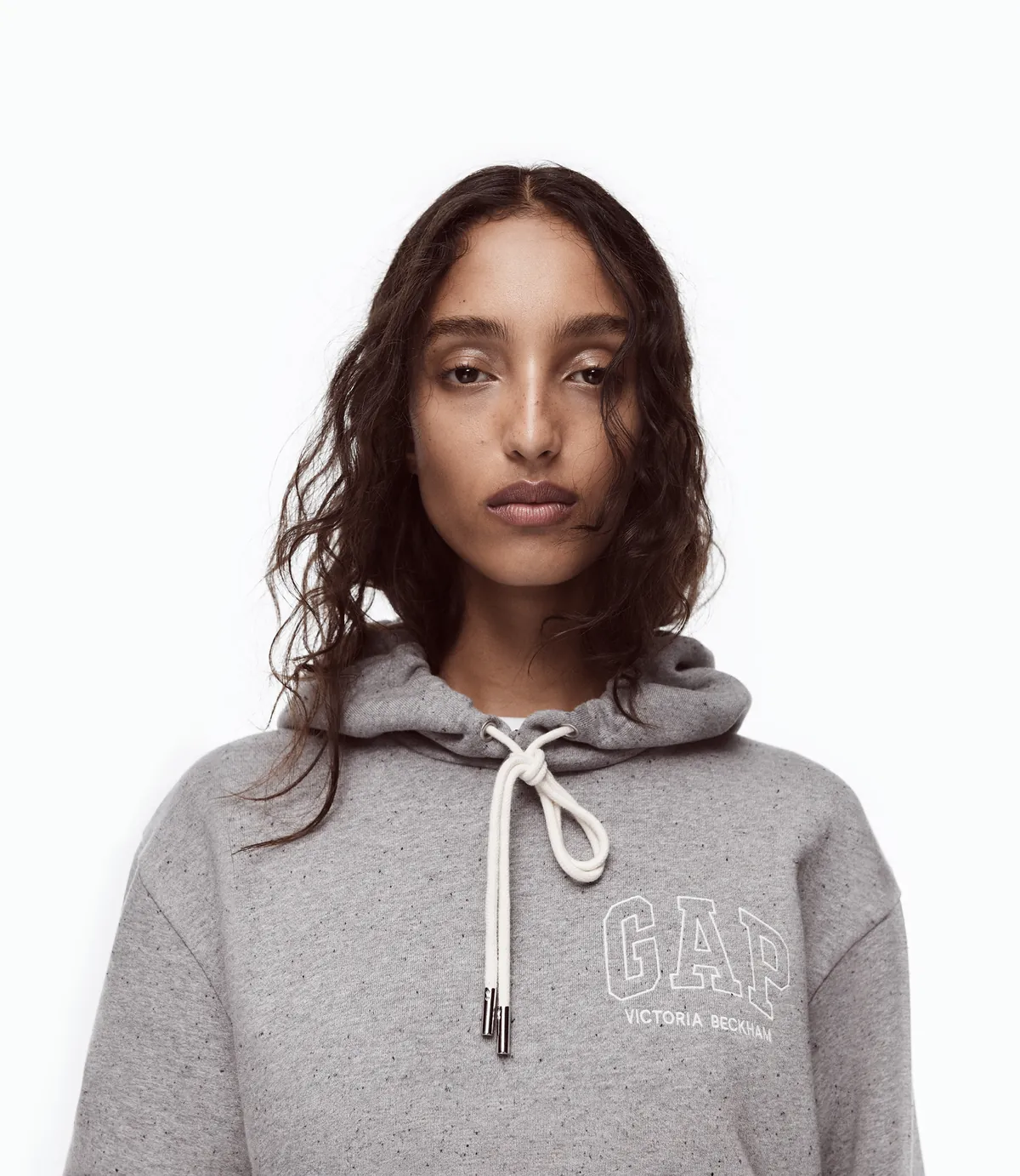 Gap Victoria Beckham Fall/Winter 2026 campaign: Mona Tougaard in a gray Gap logo hoodie
