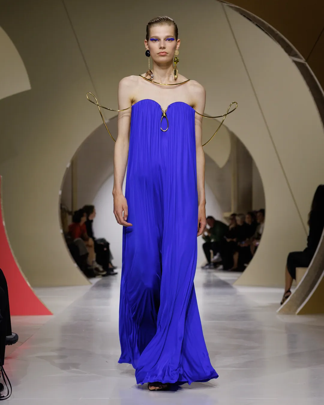 Givenchy Summer 2027 Look 40, a blue chiffon gown on a gilded frame, at Paris Fashion Week