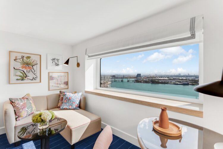 A suite at InterContinental Miami with floor-to-ceiling windows overlooking Biscayne Bay