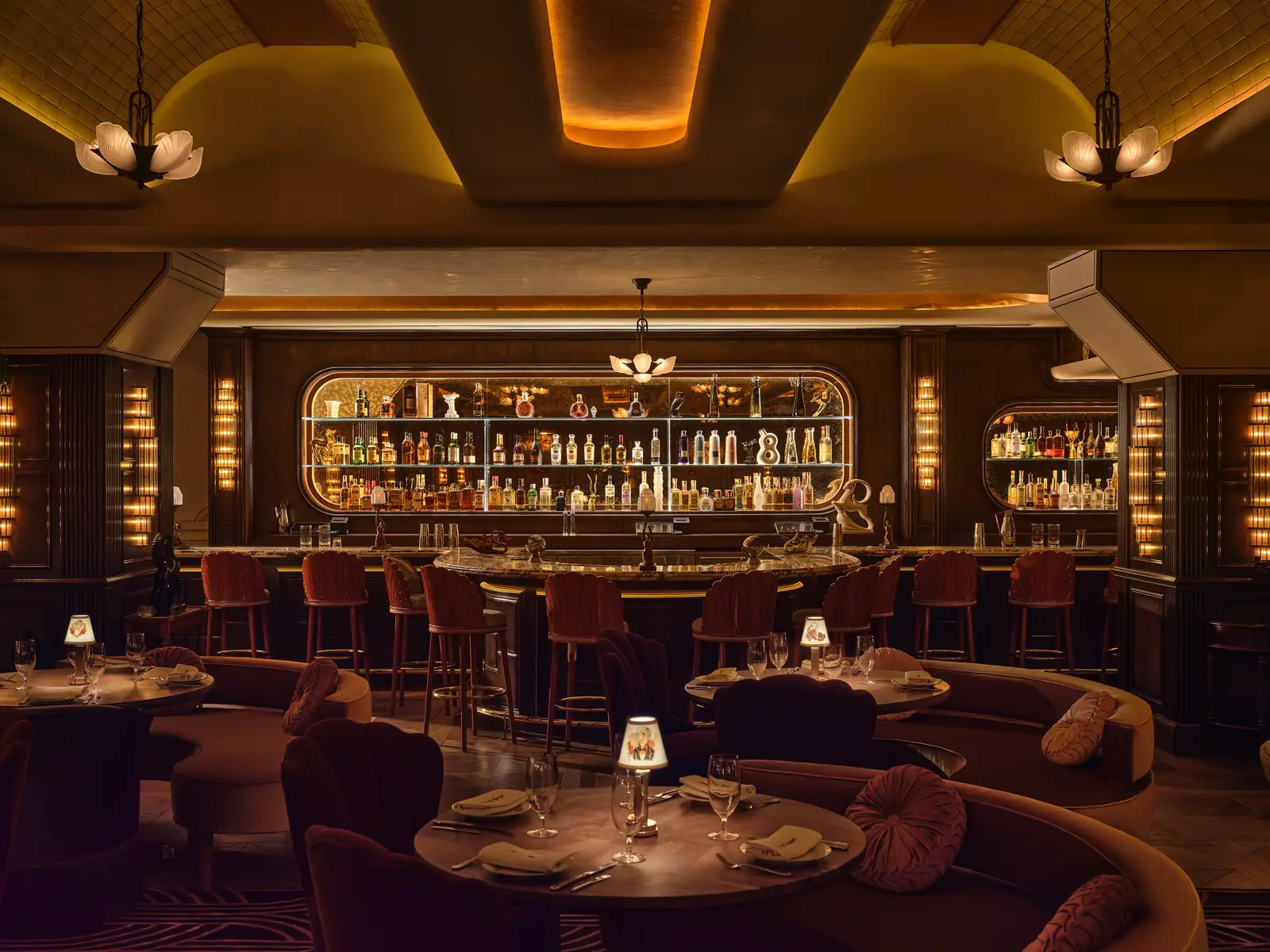 Lady Delilah NYC backlit Art Deco bar with velvet shell-back stools and tiled barrel ceiling