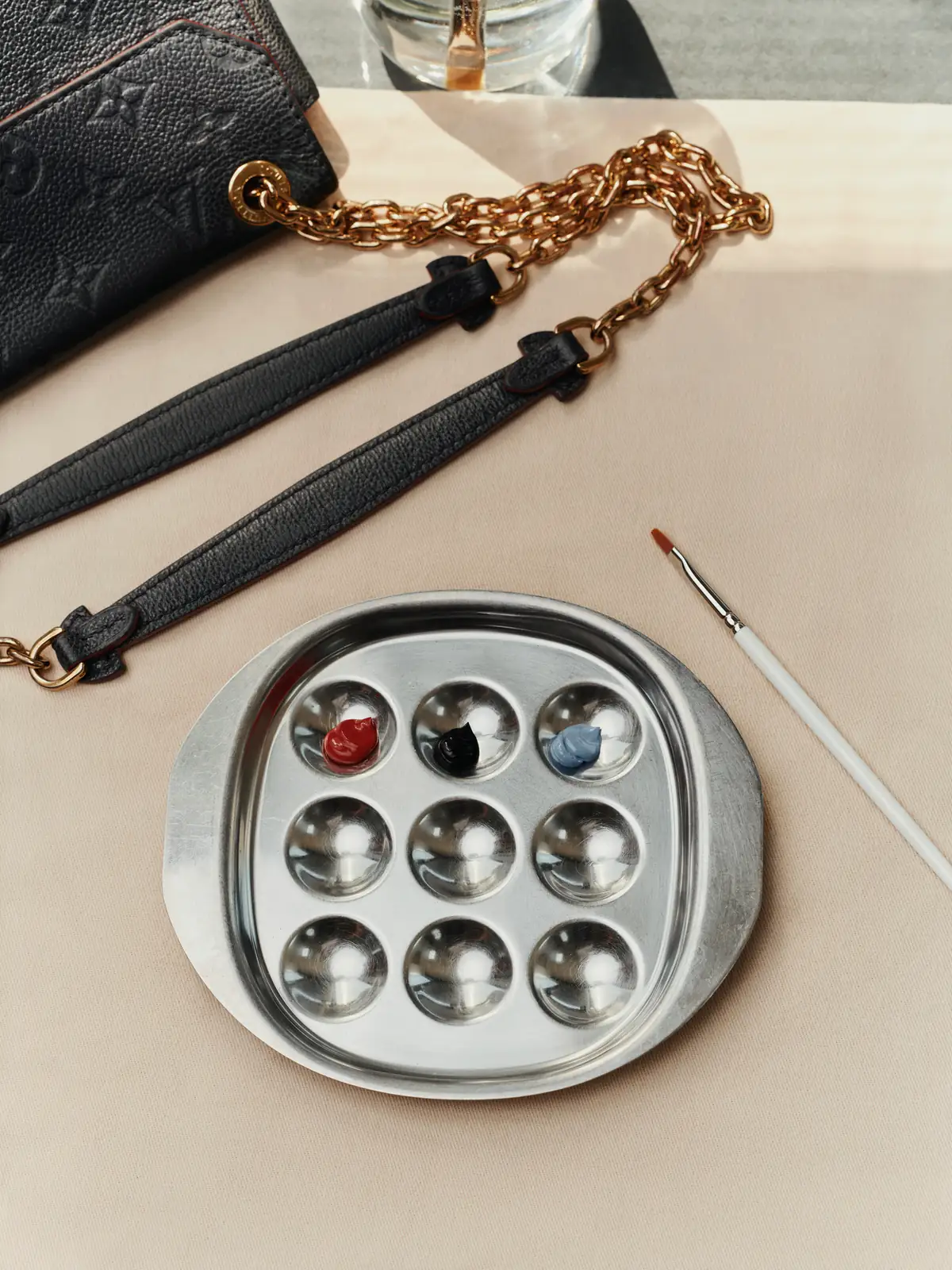Louis Vuitton Care & Repair: paint palette and brushes used for leather recoloring