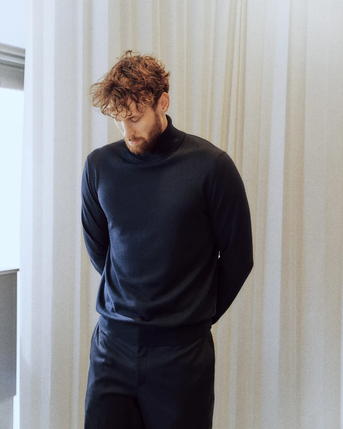 Real Madrid basketball player Mikael Jantunen in a navy Louis Vuitton Real Madrid sweater