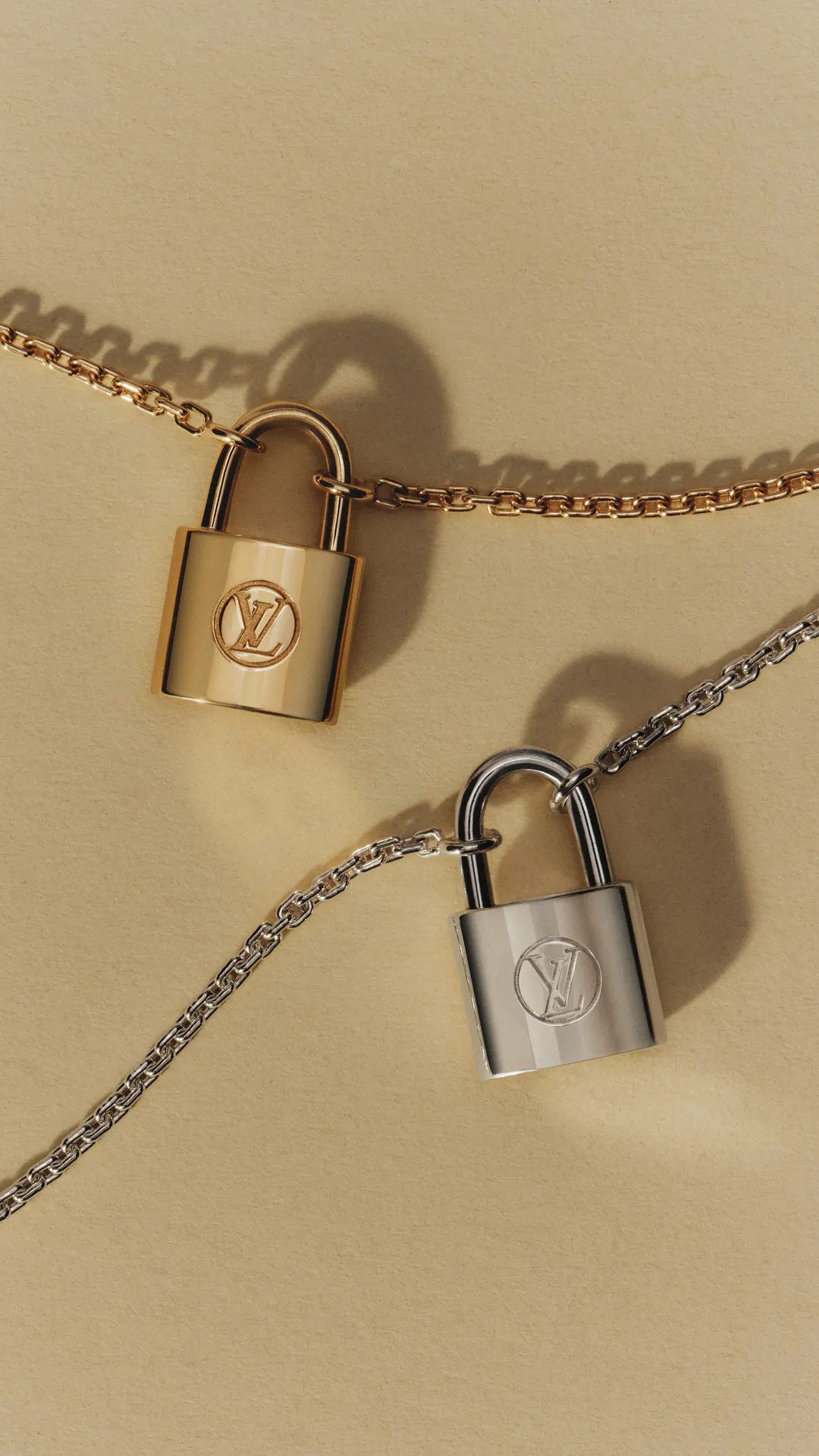 Louis Vuitton for UNICEF: Silver Lockit pendants on silver chains