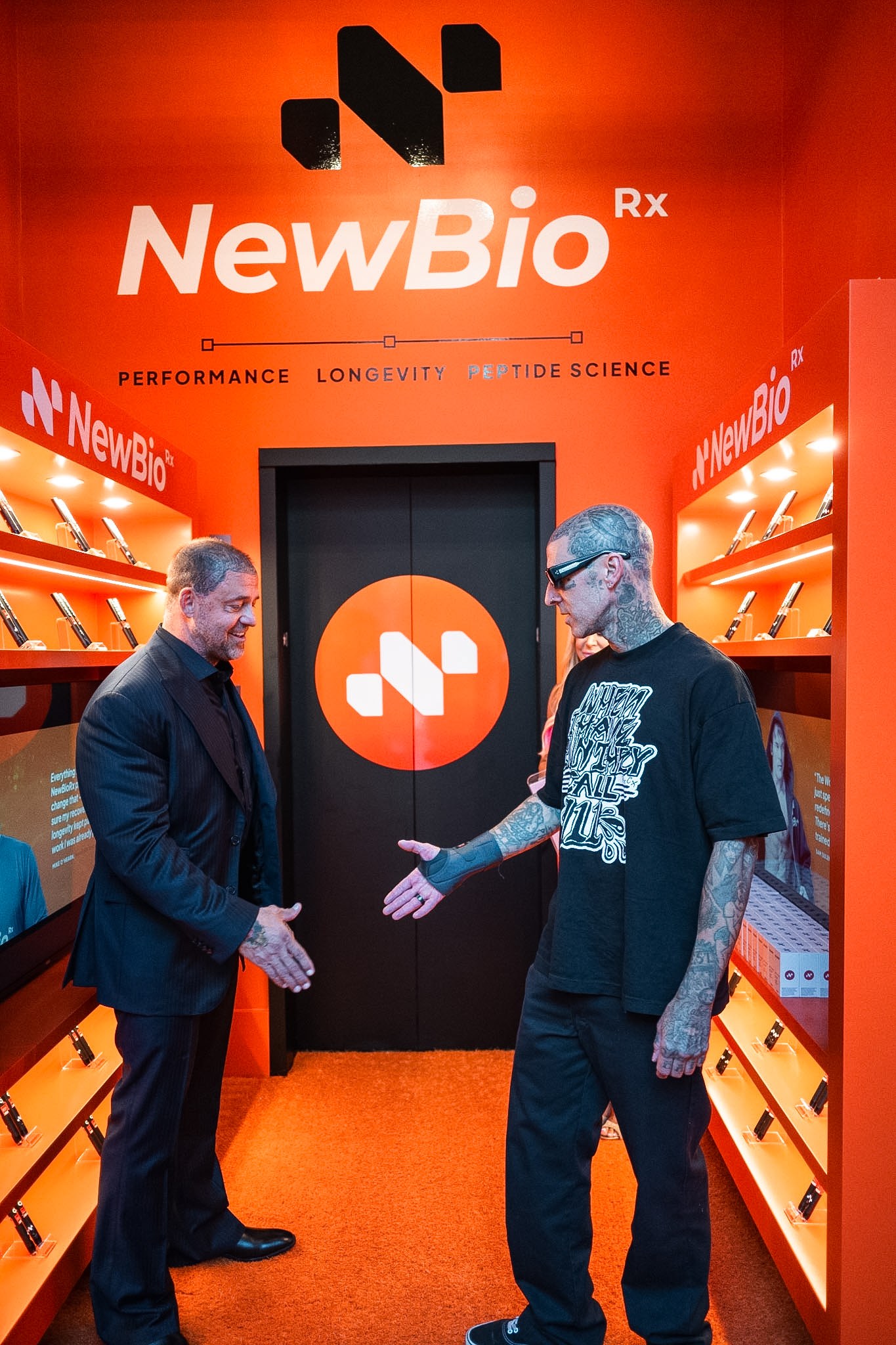 Dr. Thomas Connelly greets Travis Barker at the opening of the NewBioRx flagship in Beverly Hills