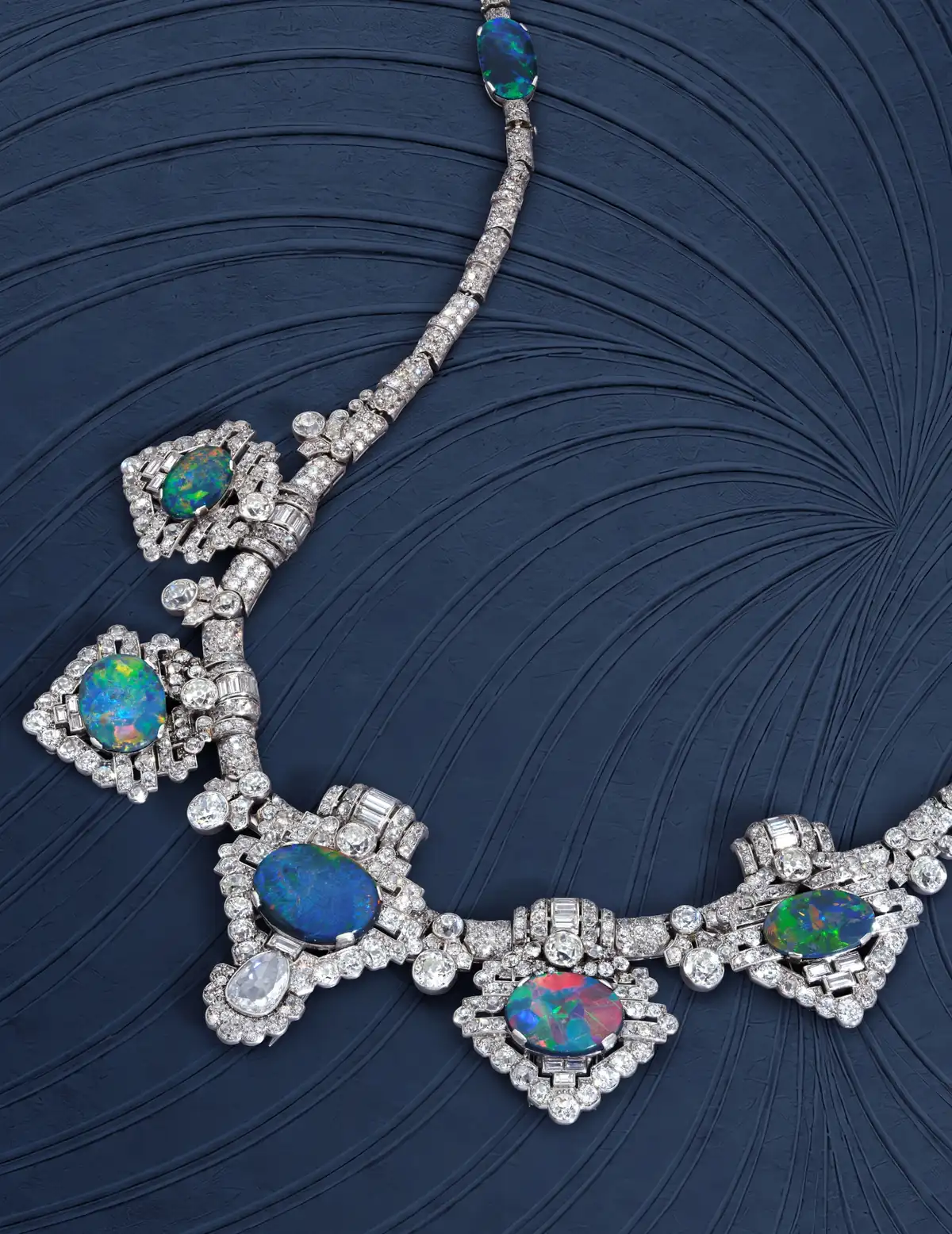 Full view of the Devonshire Cartier opal tiara/necklace with five black opal brooches, offered at Sotheby’s Geneva
