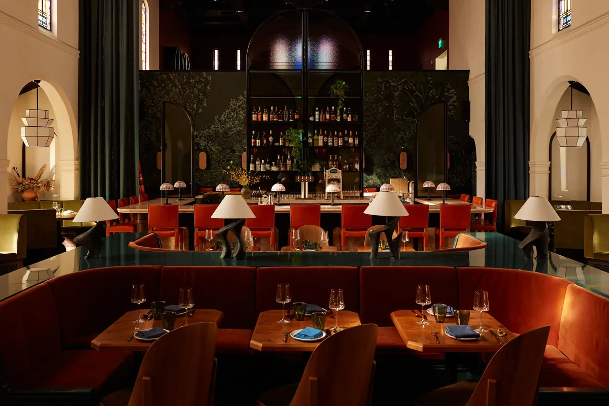 Red banquettes and arched bar at Sous Sous in Hotel Lucile, one of the best new restaurants in Los Angeles
