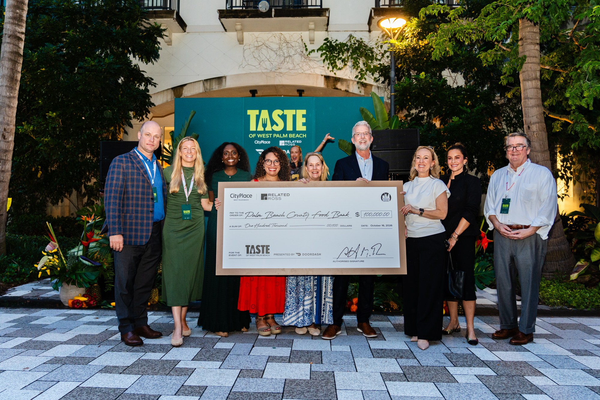 A $100,000 check presented to the Palm Beach County Food Bank at Taste of West Palm Beach