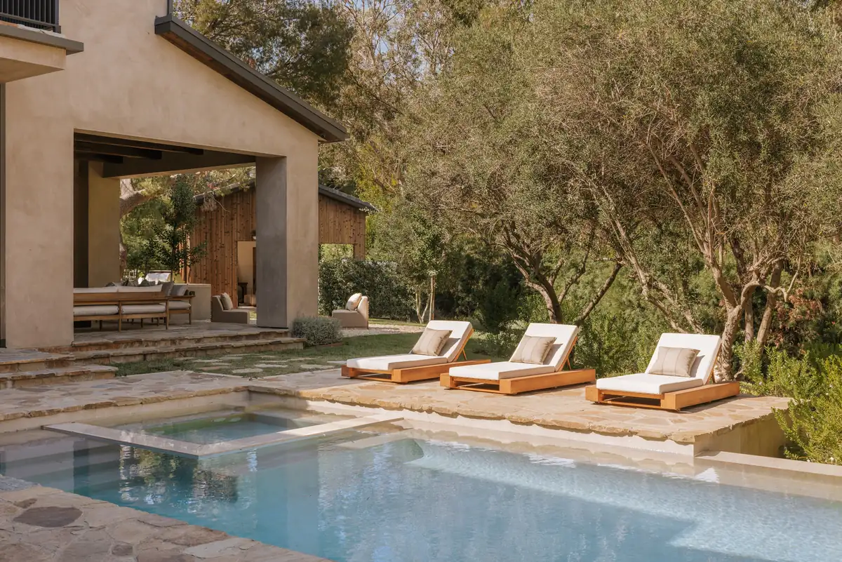 Three Planes Hidden Hills resort-style pool and spa with lounge chairs
