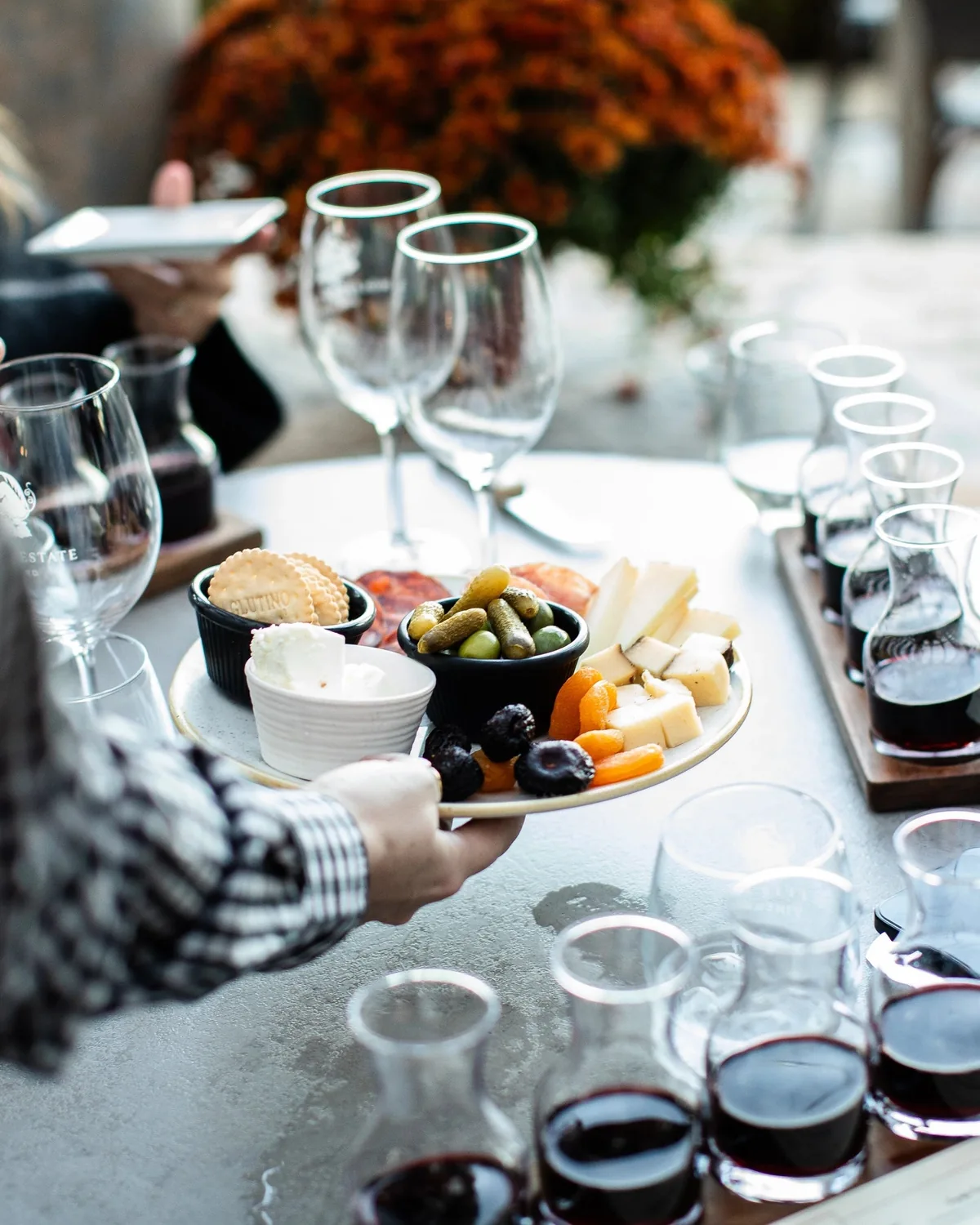Wine tasting with charcuterie at Wölffer Estate in Sagaponack, among the best wineries North Fork Hamptons