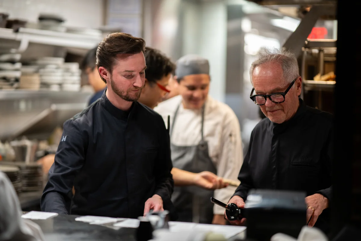 Byron Lazaroff-Puck and Wolfgang Puck at the kitchen pass at Cut